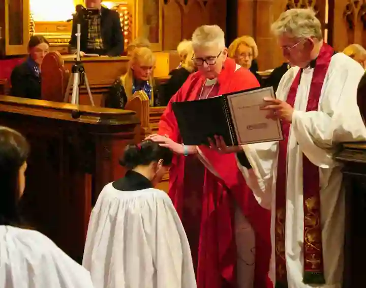 Bishop Julie lays her hands on Margaret during her ordination