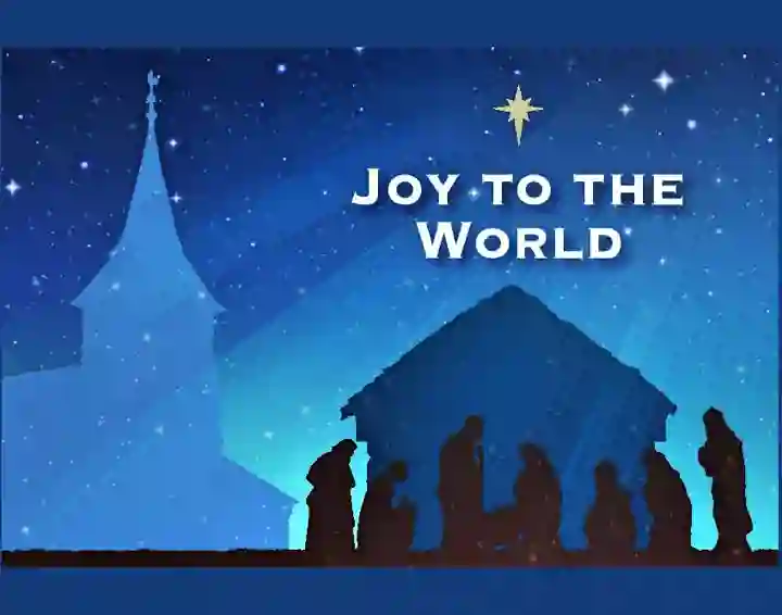 Outline of church tower and a stable with figures in front and the words "Joy to the World"