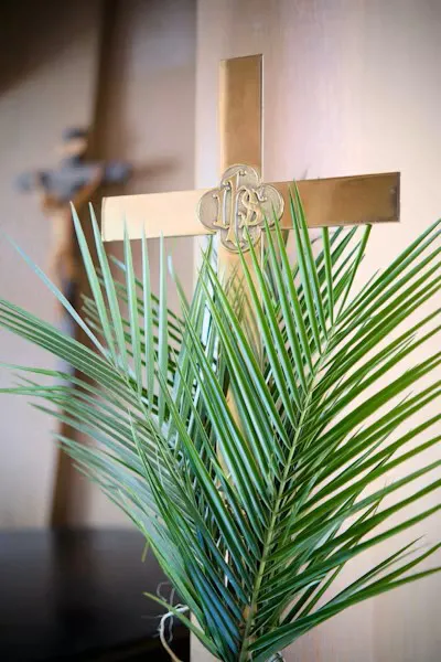 A cross with palm fronds