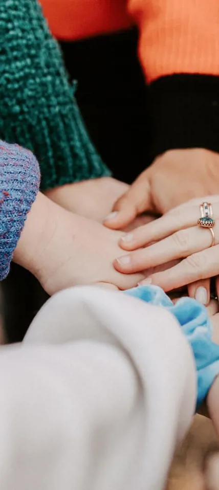 Group of people holding hands