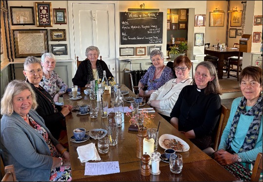 Ladies sat around a restaurant table