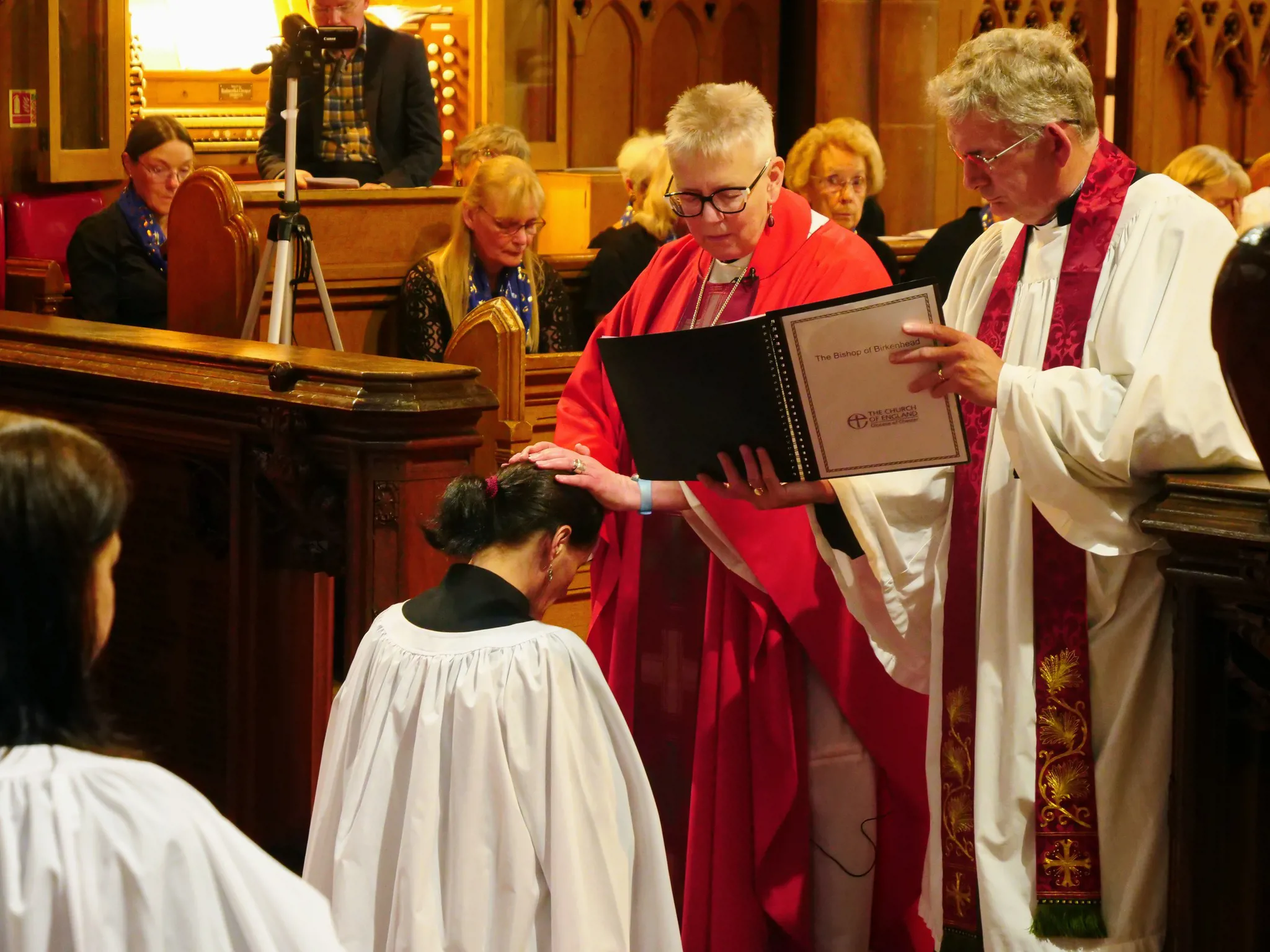 Bishop Julie lays her hands on Margaret during her ordination